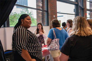 Dr. Alydia Thomas speaking with students