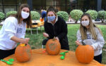 Photo of 3 female students with pumpkins