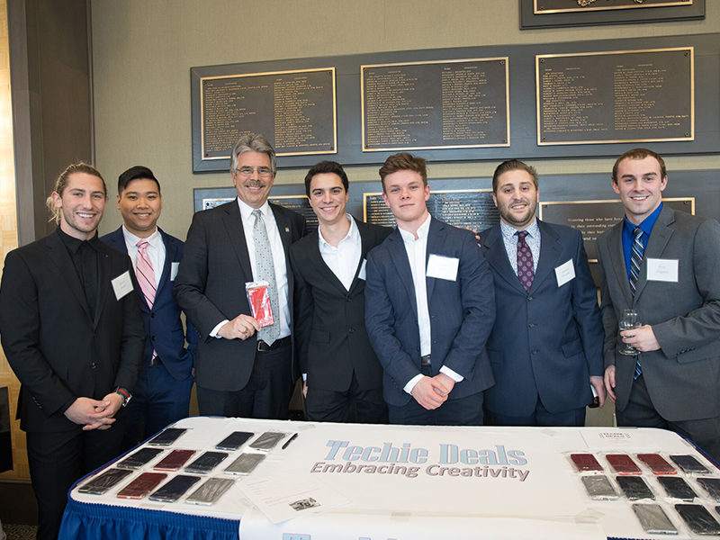 President Ken Gormley with members of Techie Deals, a company created by Duquesne